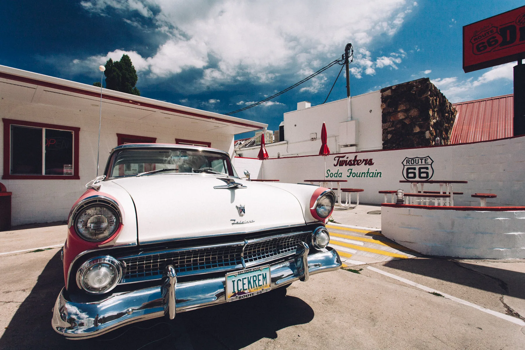 A white 1950s Ford parked outside Twisters Soda Fountain in Williams