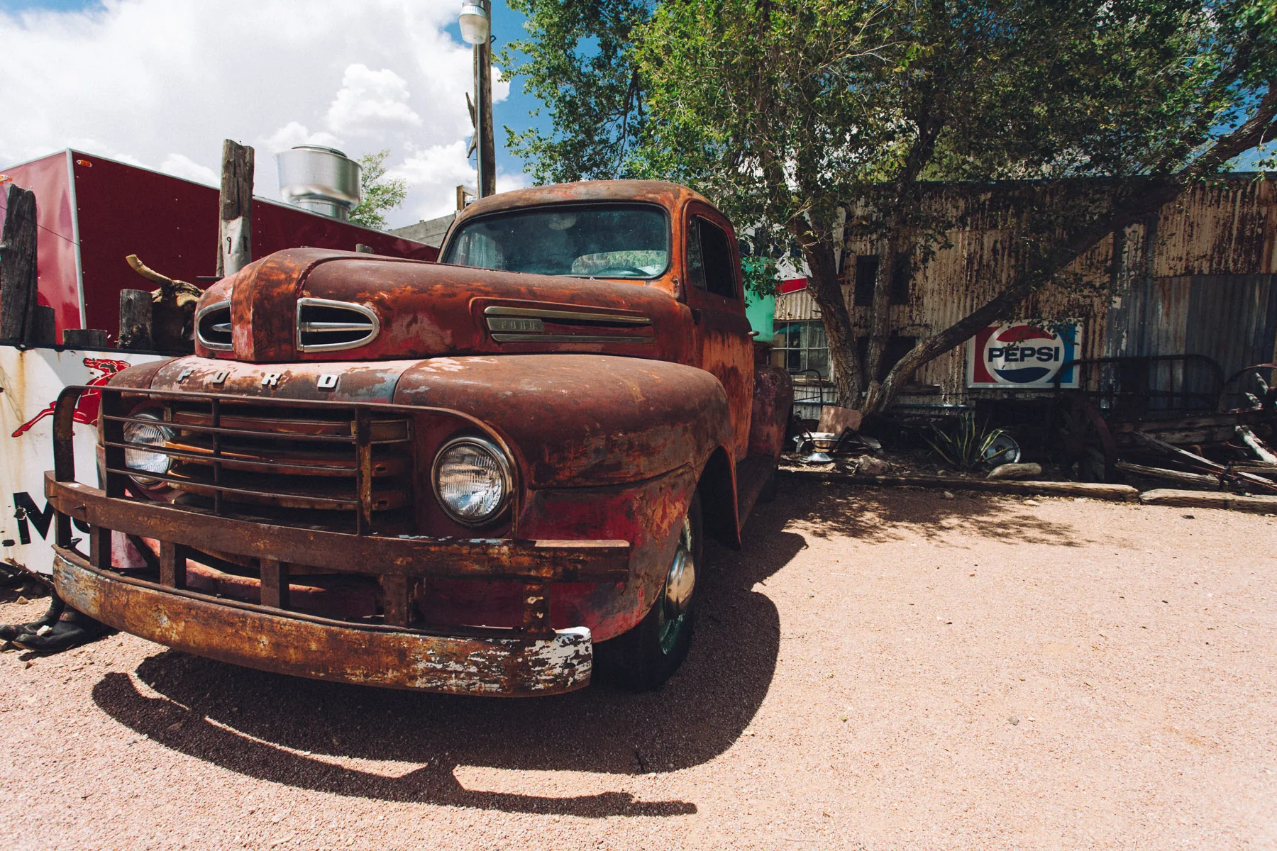 A rusted Ford pickup in the yard of the Hackberry General Store