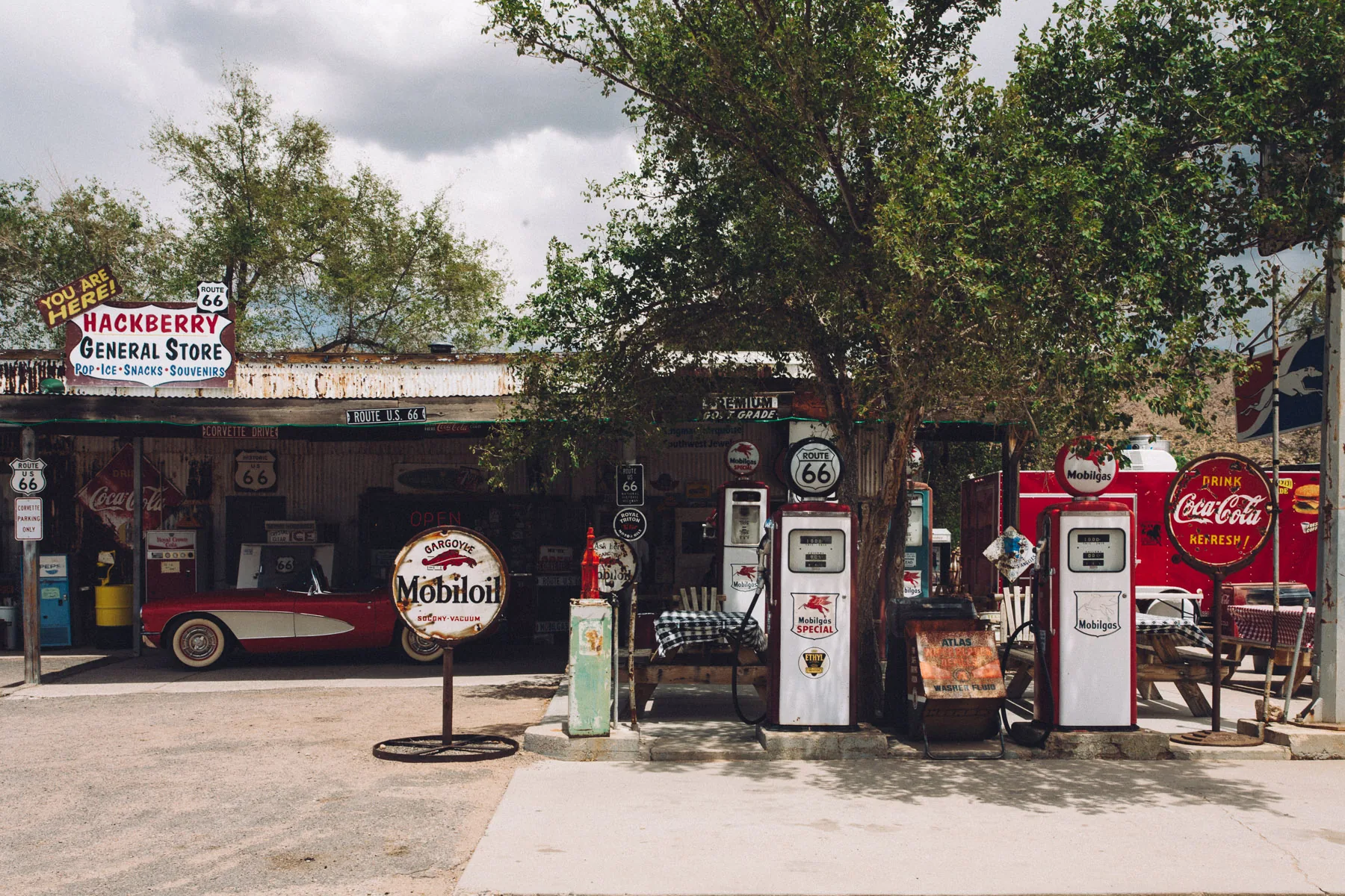Vintage gas pumps and a red Corvette at the Hackberry General Store