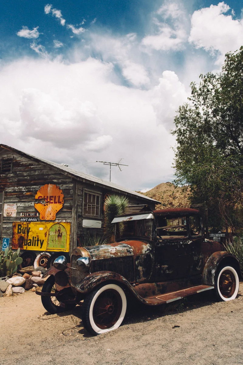 A Model T truck parked in front of the general store