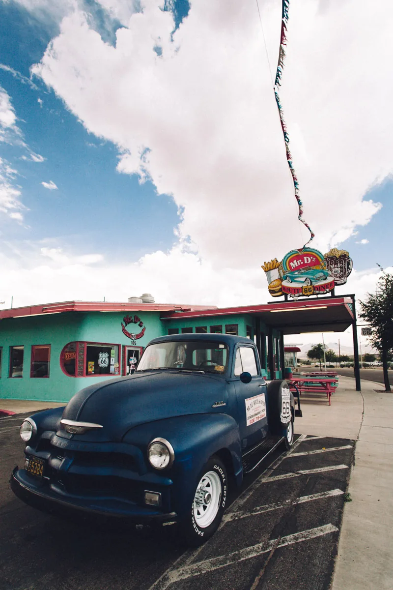 A vintage blue pickup outside Mr D'z Diner