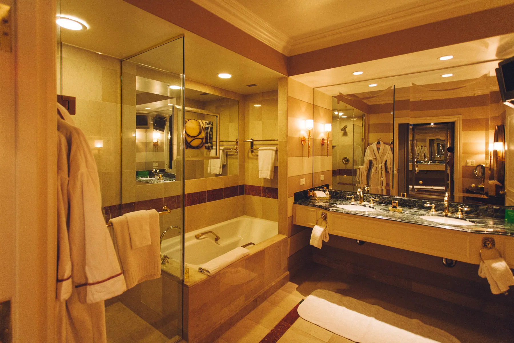 The double vanity and tub in the suite bathroom