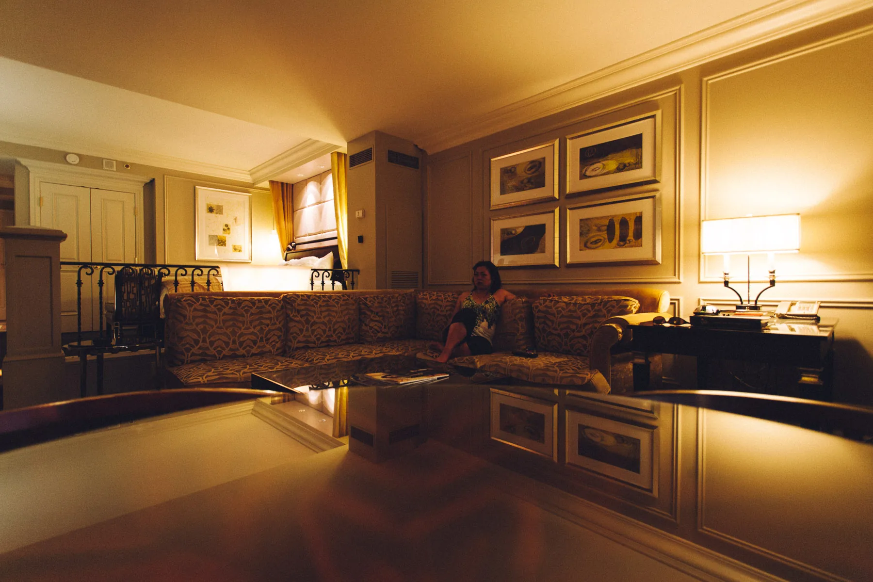 The suite living room reflected in a glossy table