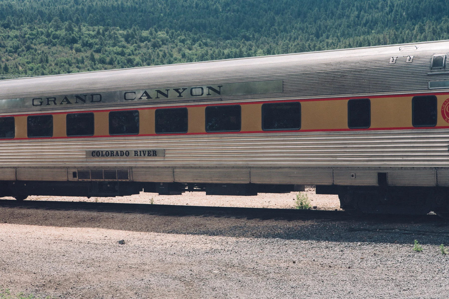 A Grand Canyon railcar parked by the tracks