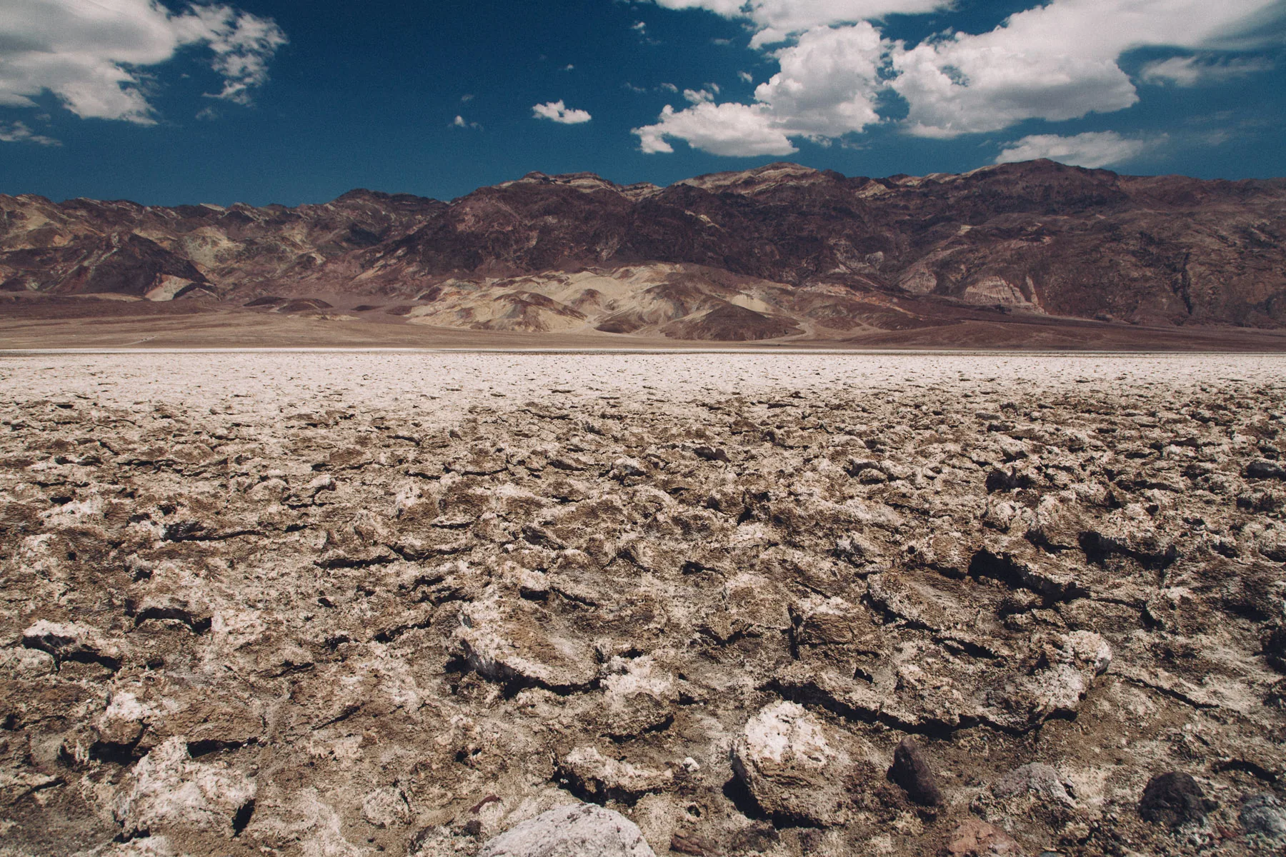 Rough salt clods under a blue sky