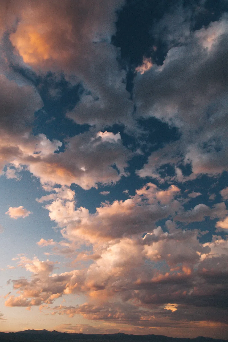 Clouds lit pink and gold at dusk