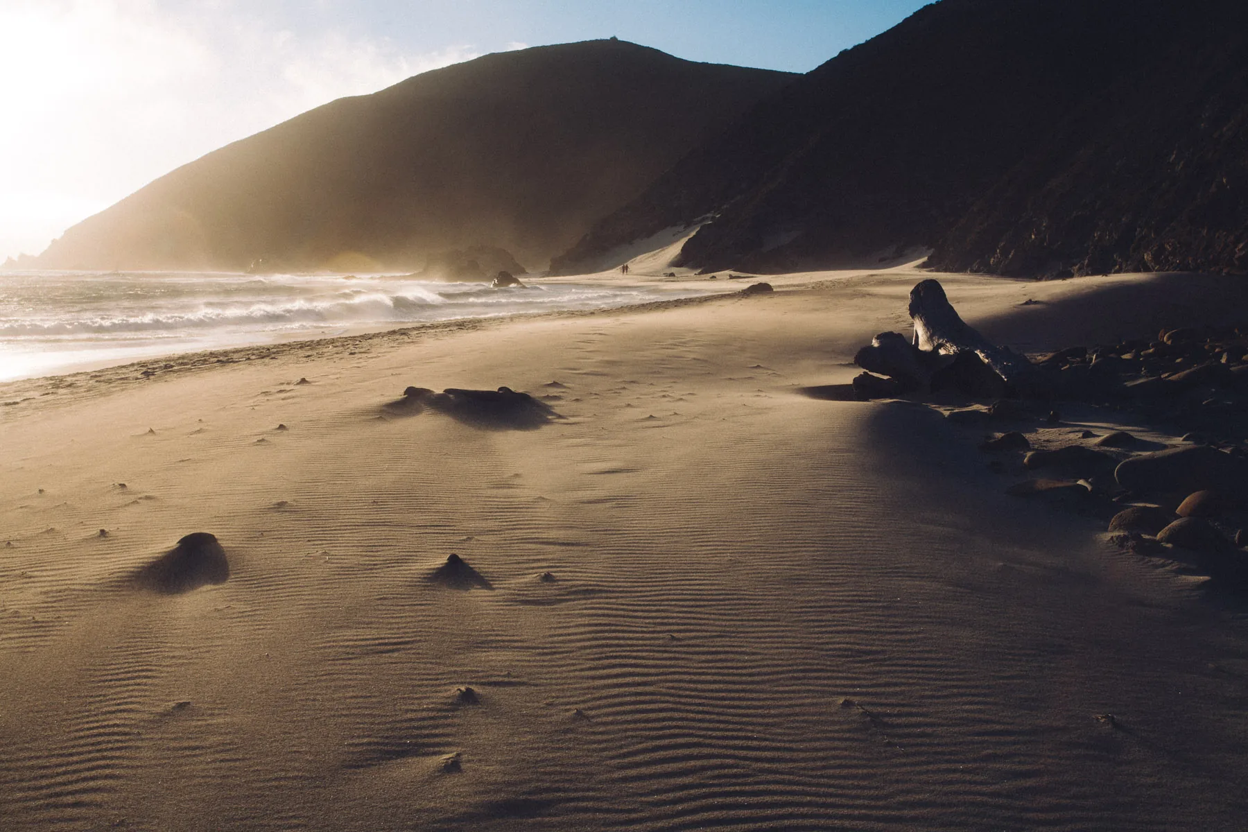 Wind-blown sand at Pfeiffer Beach under the hills