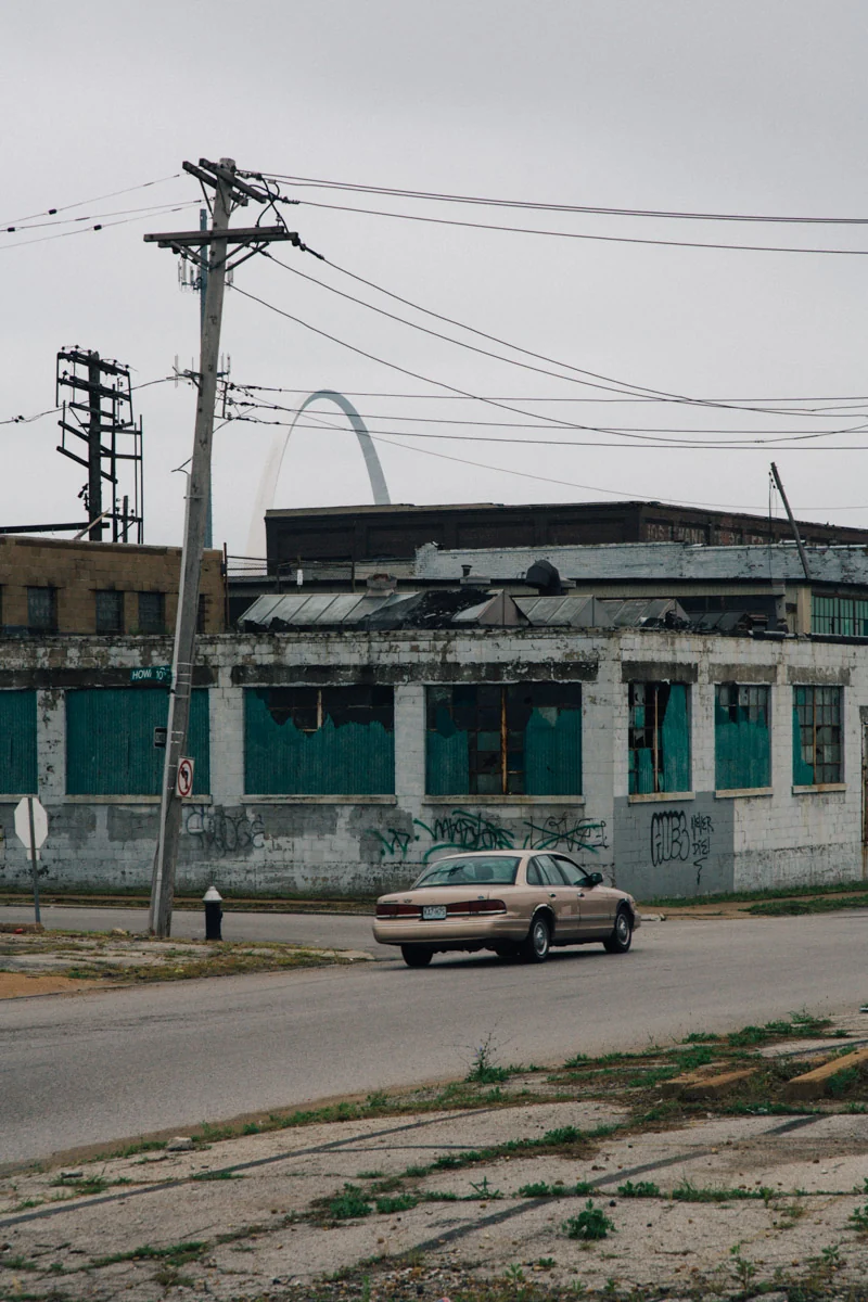 An abandoned building and a utility pole on a St. Louis street