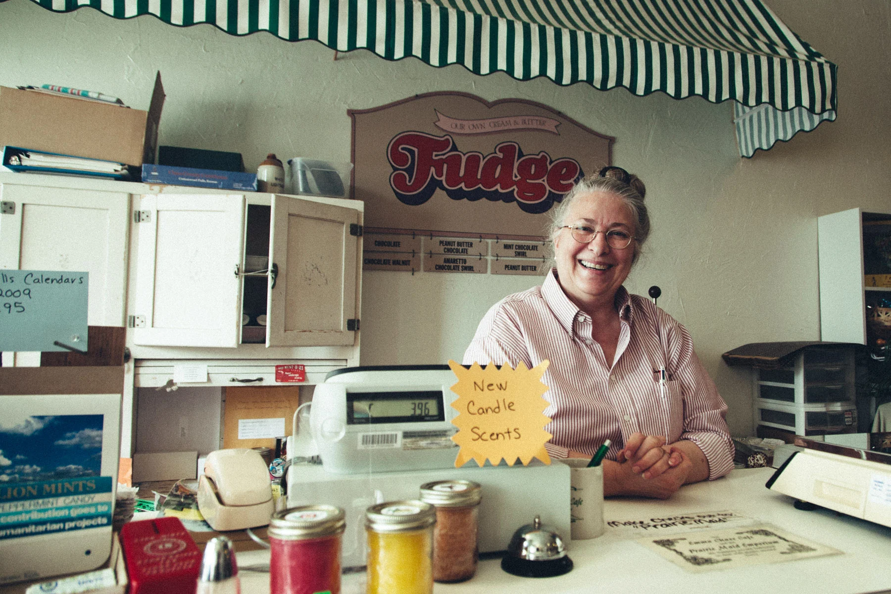 Emma Chase smiling behind the counter of her café
