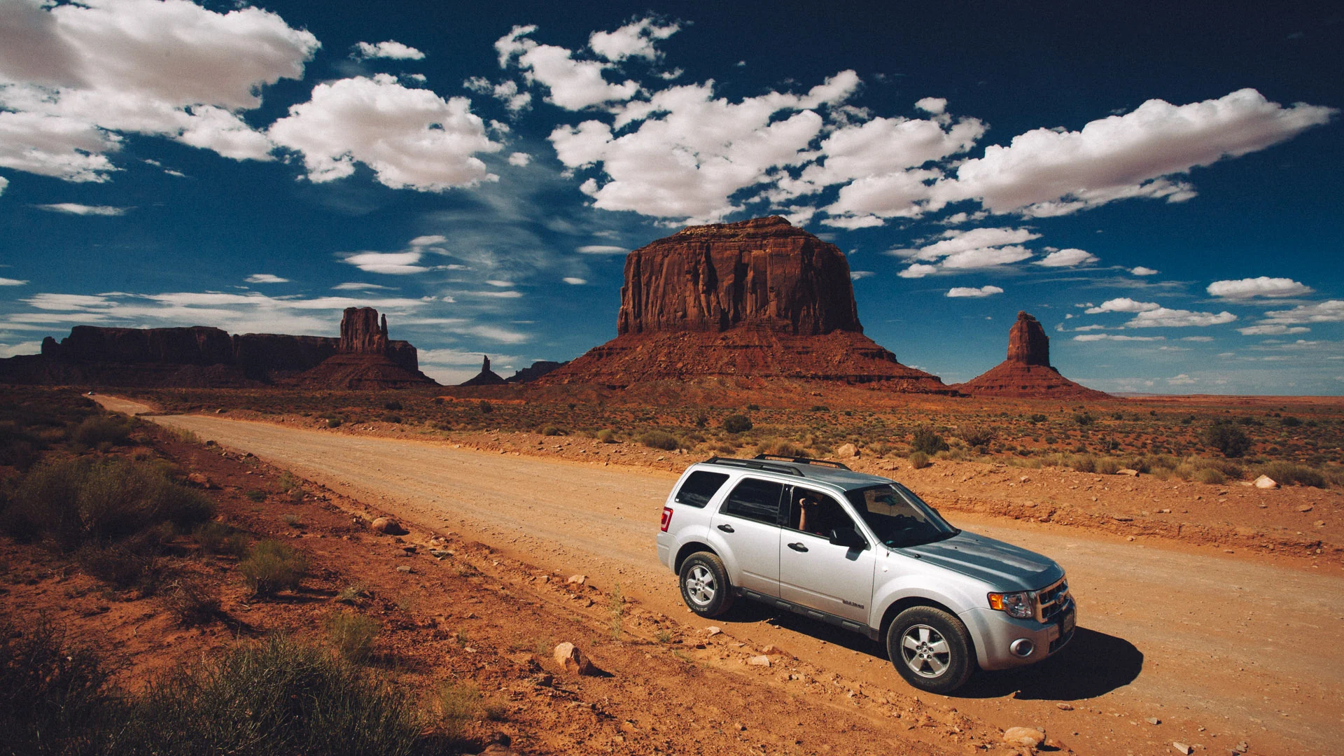 Our SUV on the red dirt road through the park