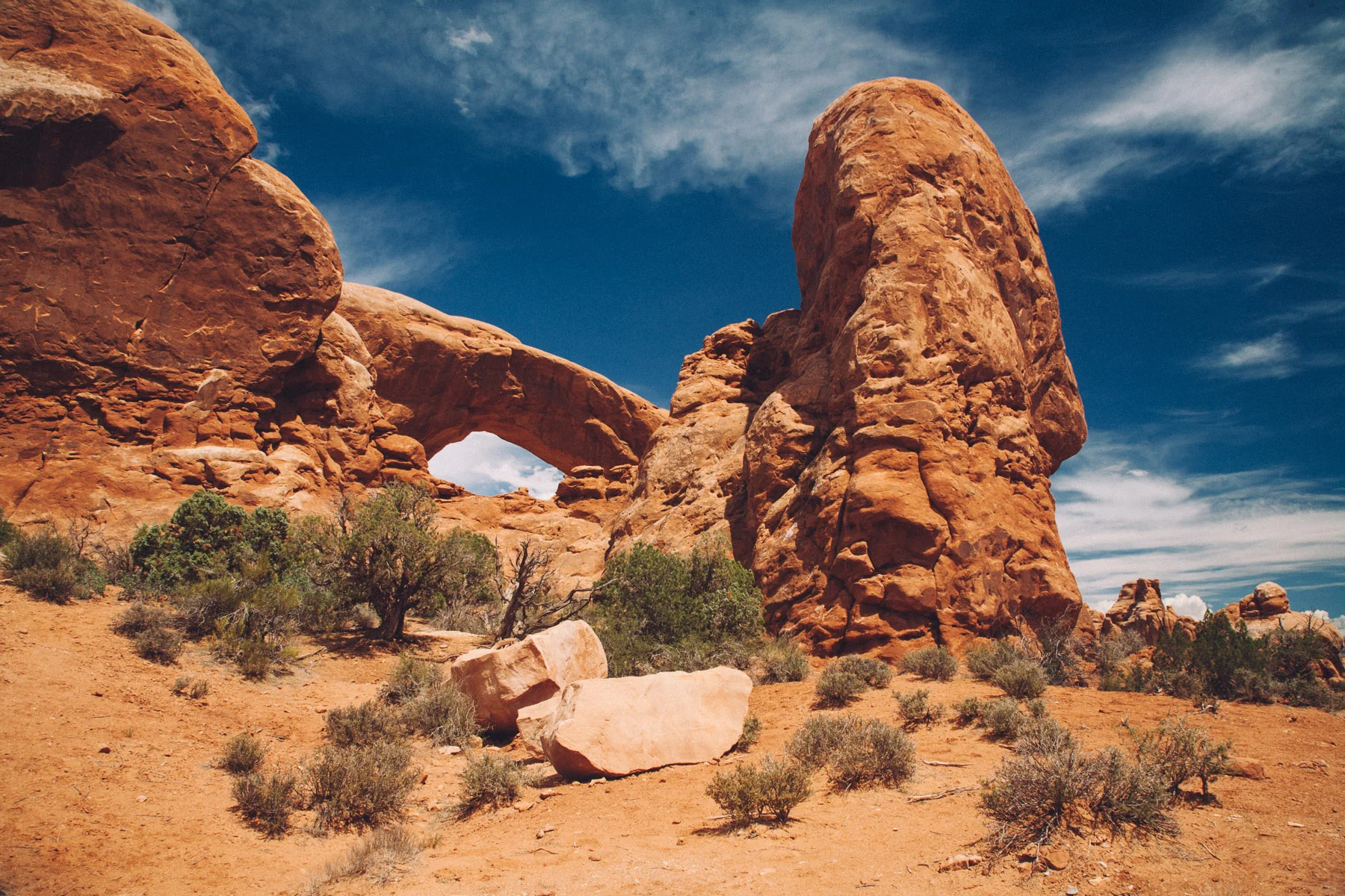 Turret Arch and the Windows beyond desert scrub