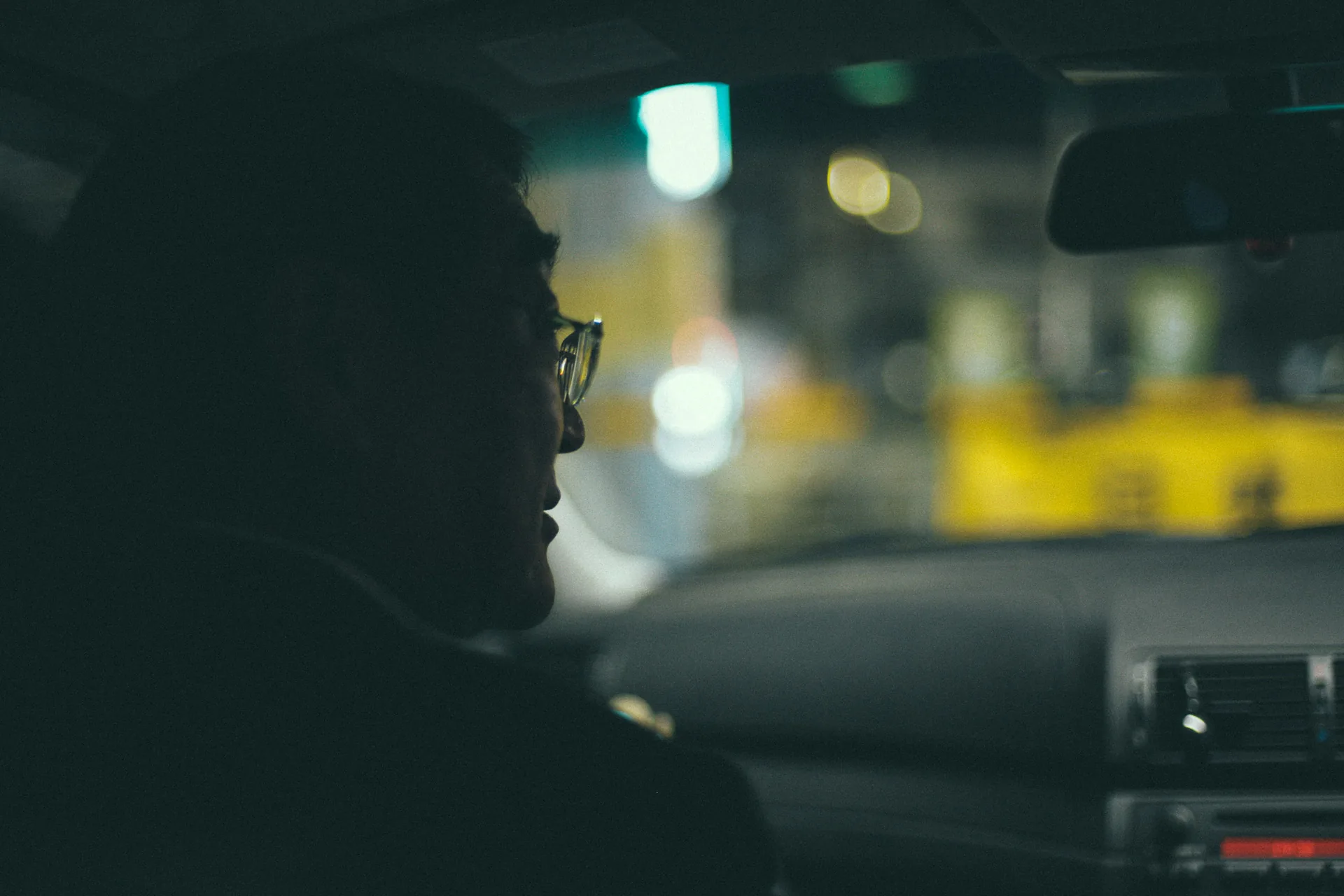 Riding through the Nagoya night, with city lights beyond the windshield