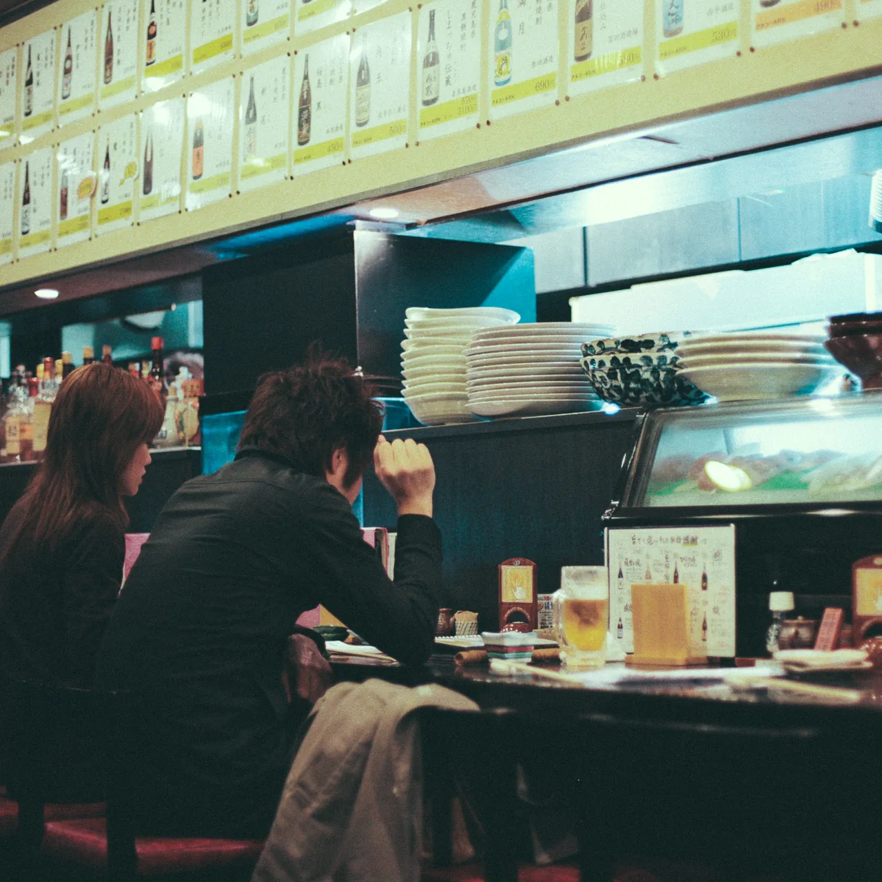 Diners at the counter of the restaurant