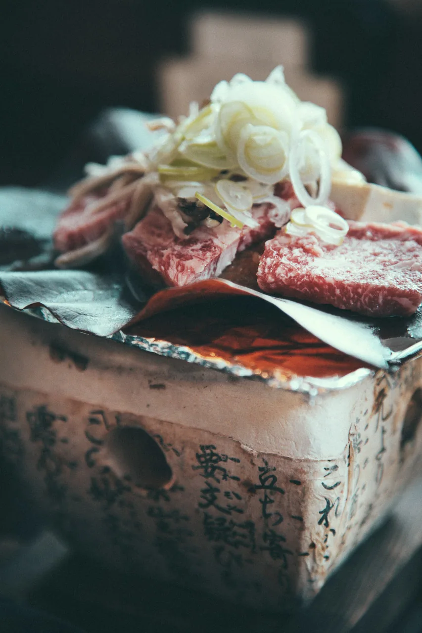 Hida beef cooking on a magnolia leaf