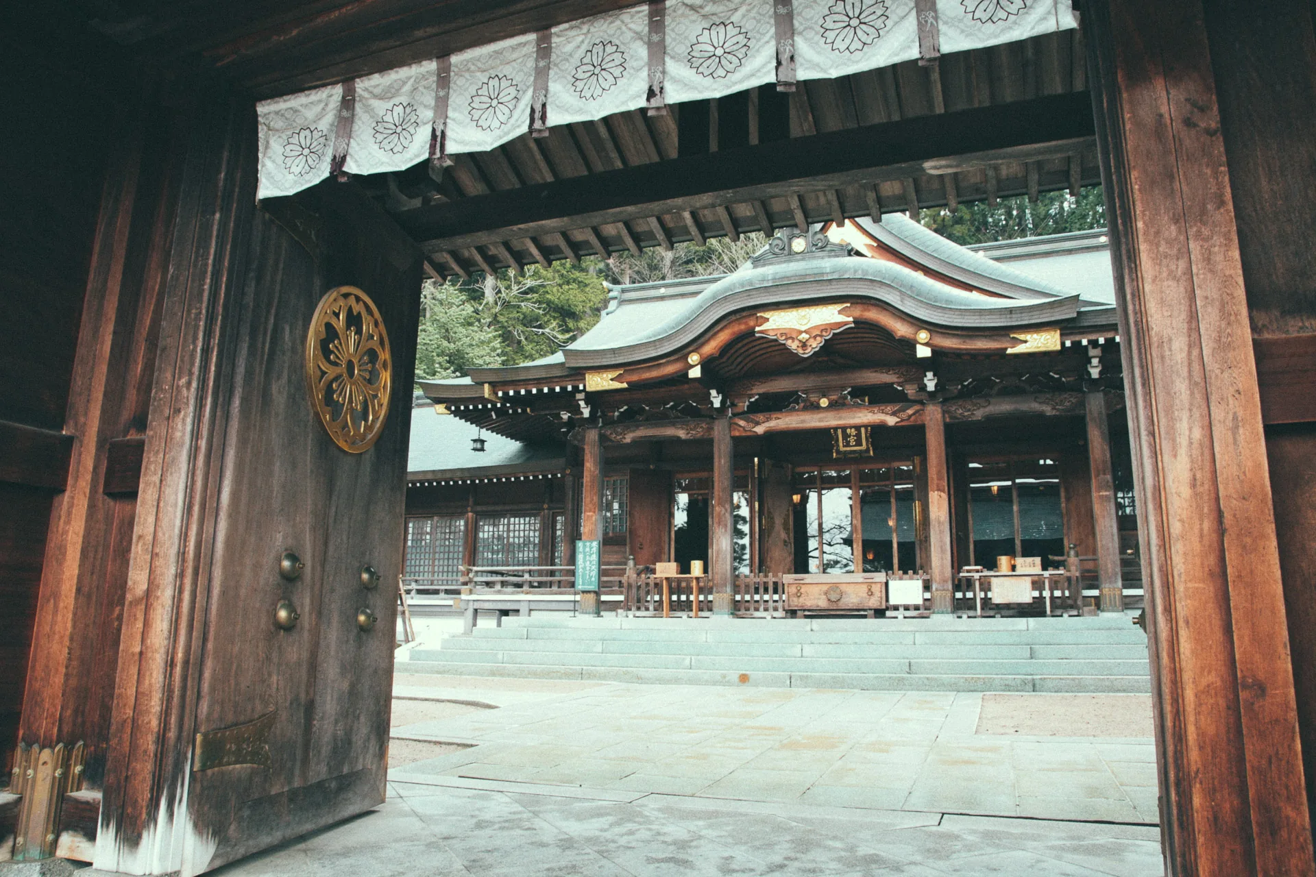 The main shrine hall seen through its great wooden gate