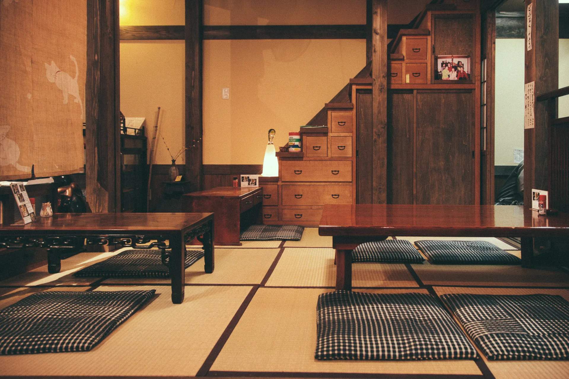 A tatami dining room with low tables and cushions