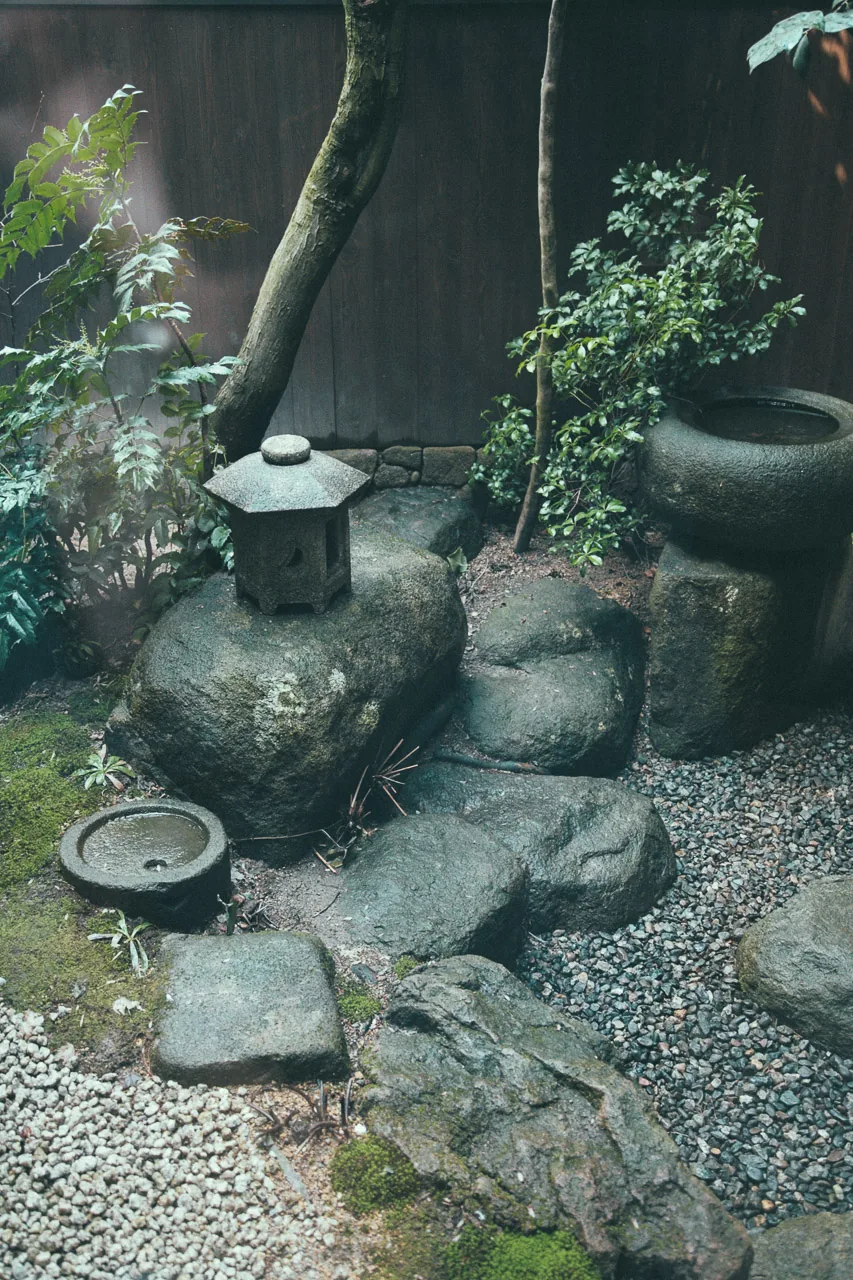 A small rock garden with a stone lantern