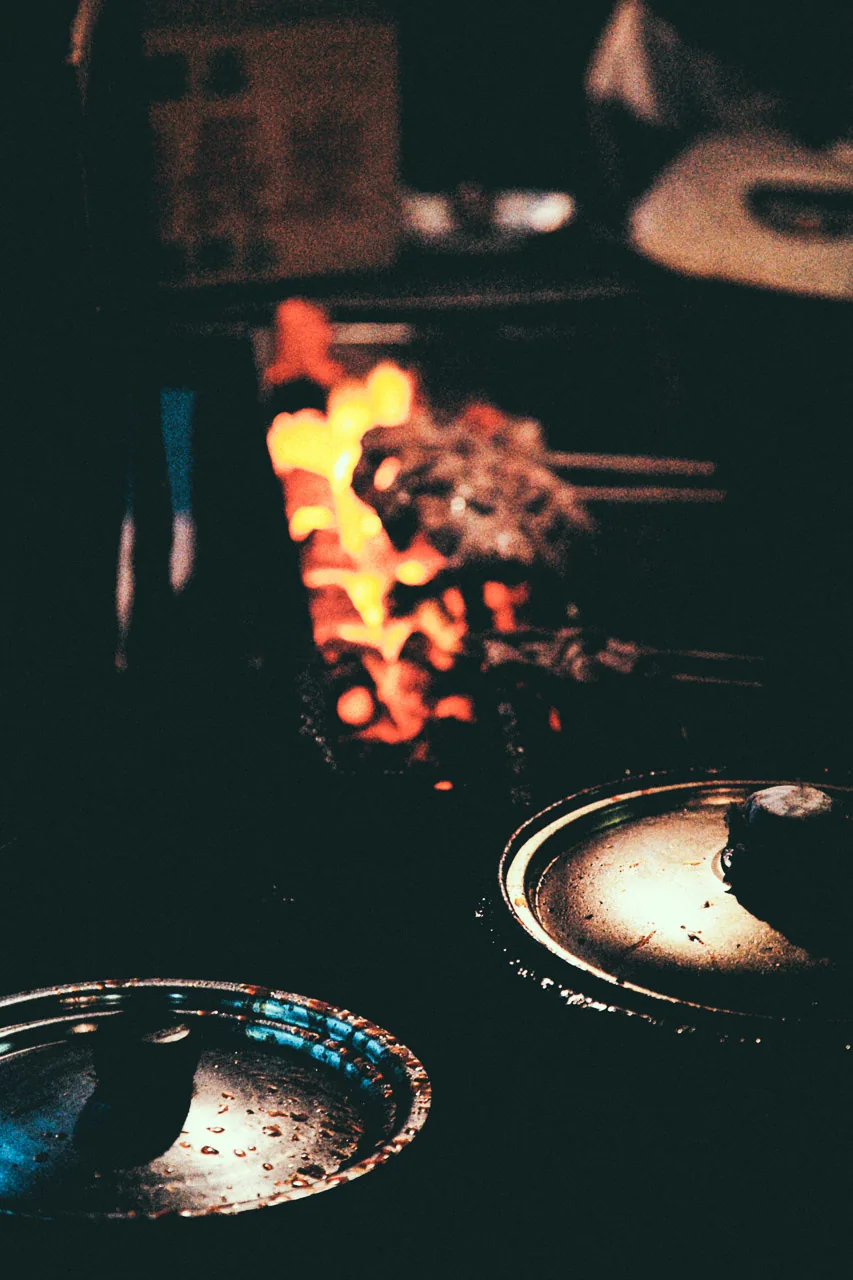 Flames rising from the charcoal grill
