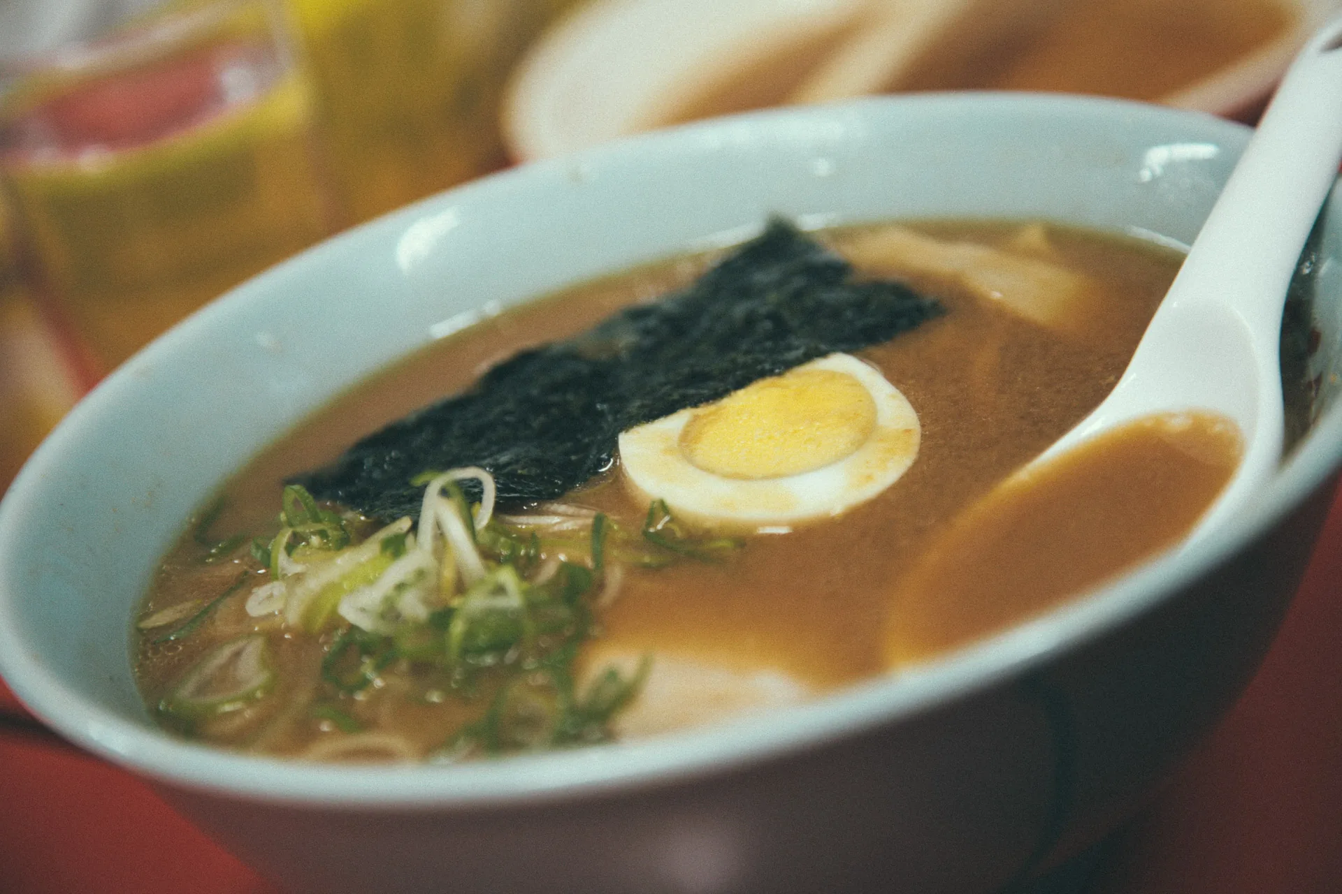 A bowl of ramen with nori and egg