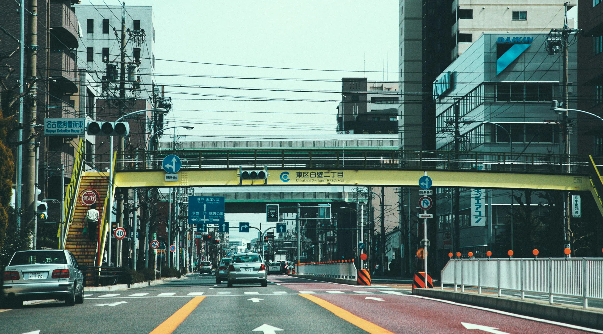 A pedestrian bridge across a wide Nagoya avenue