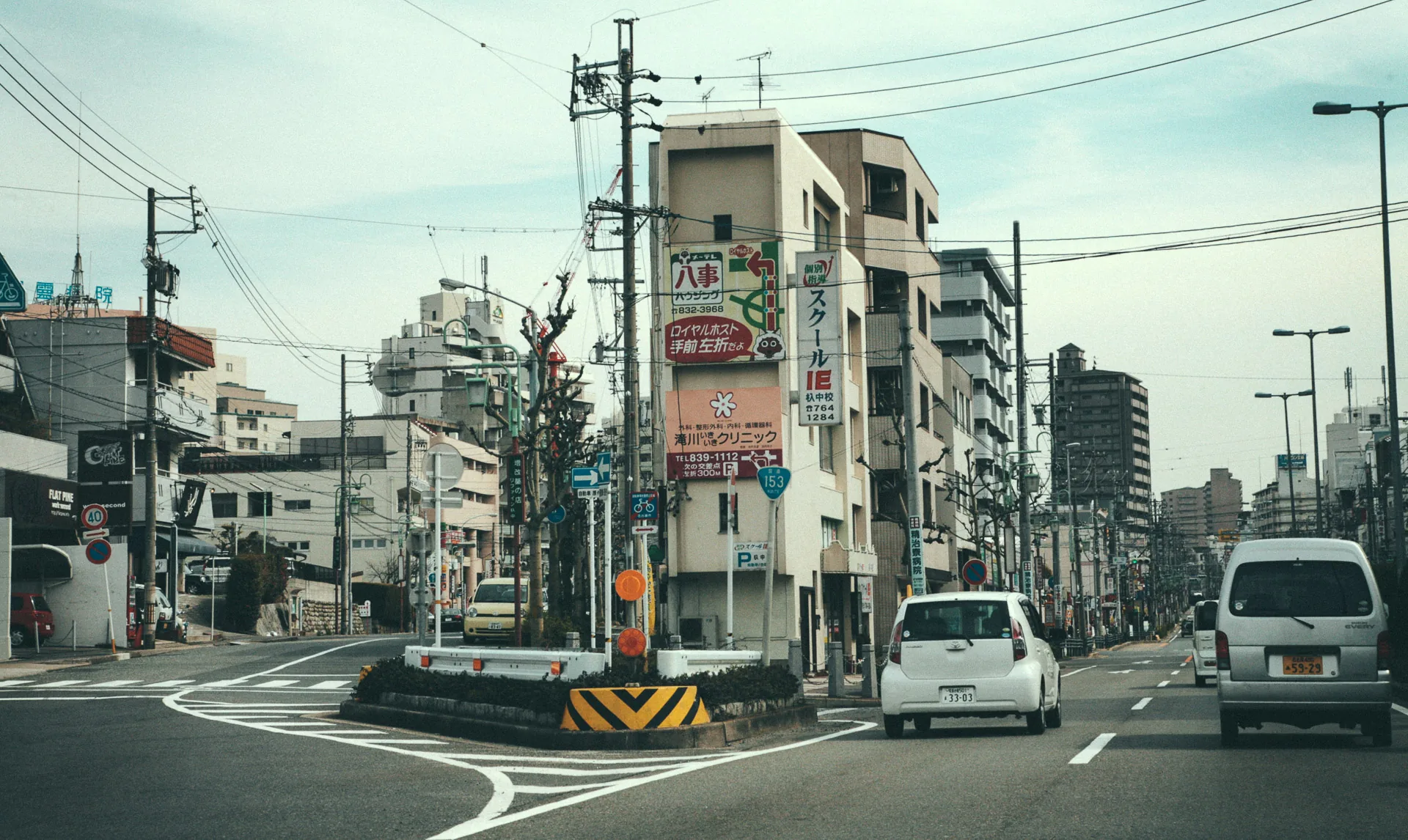 A busy intersection with apartment buildings