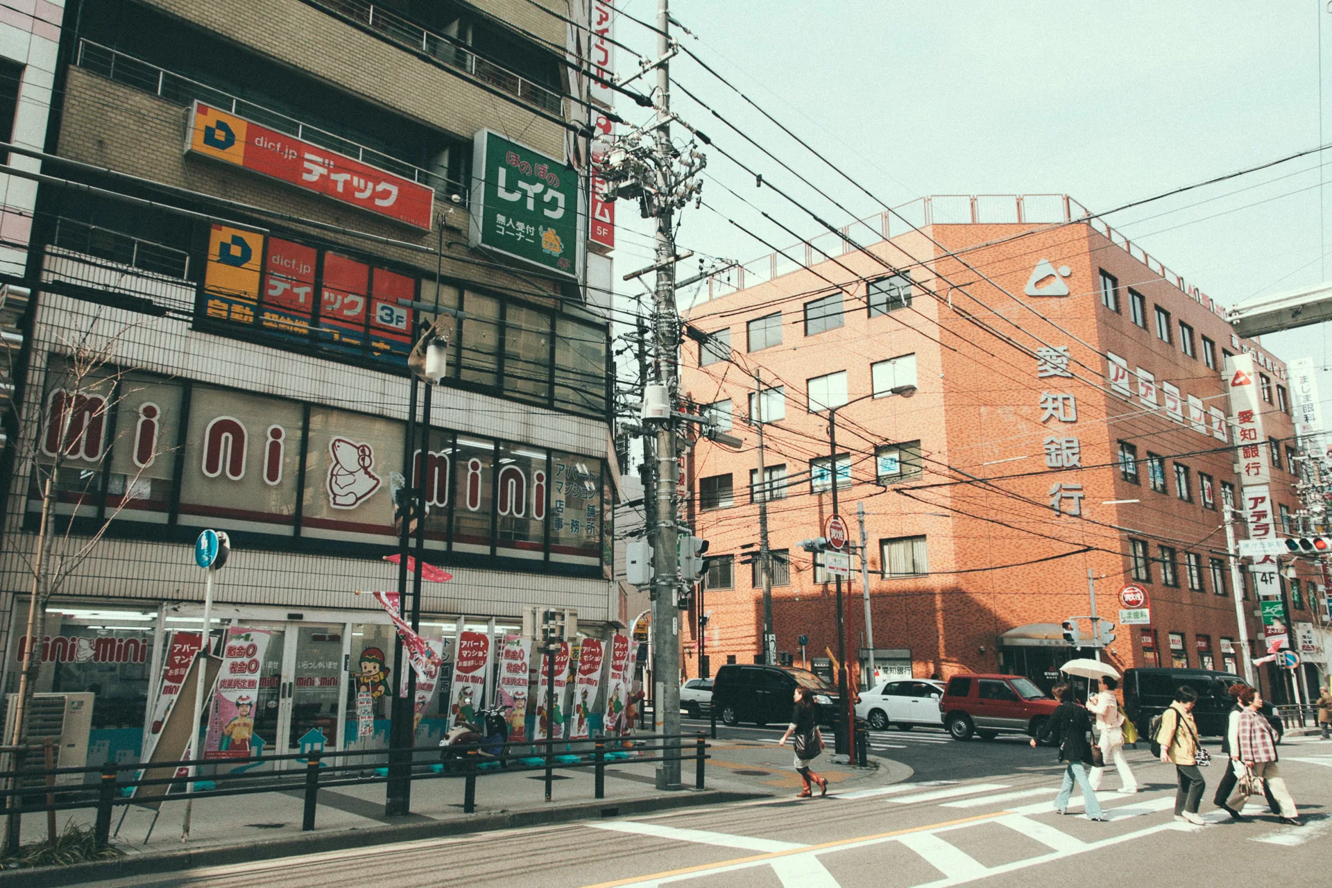 Shops and pedestrians at a busy corner