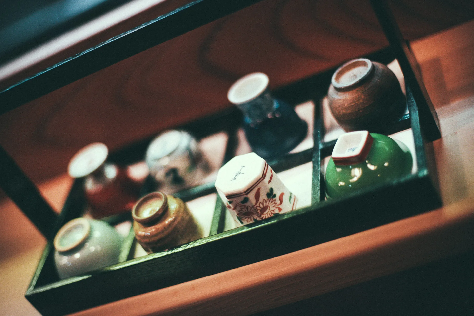 Antique cups in a wooden box