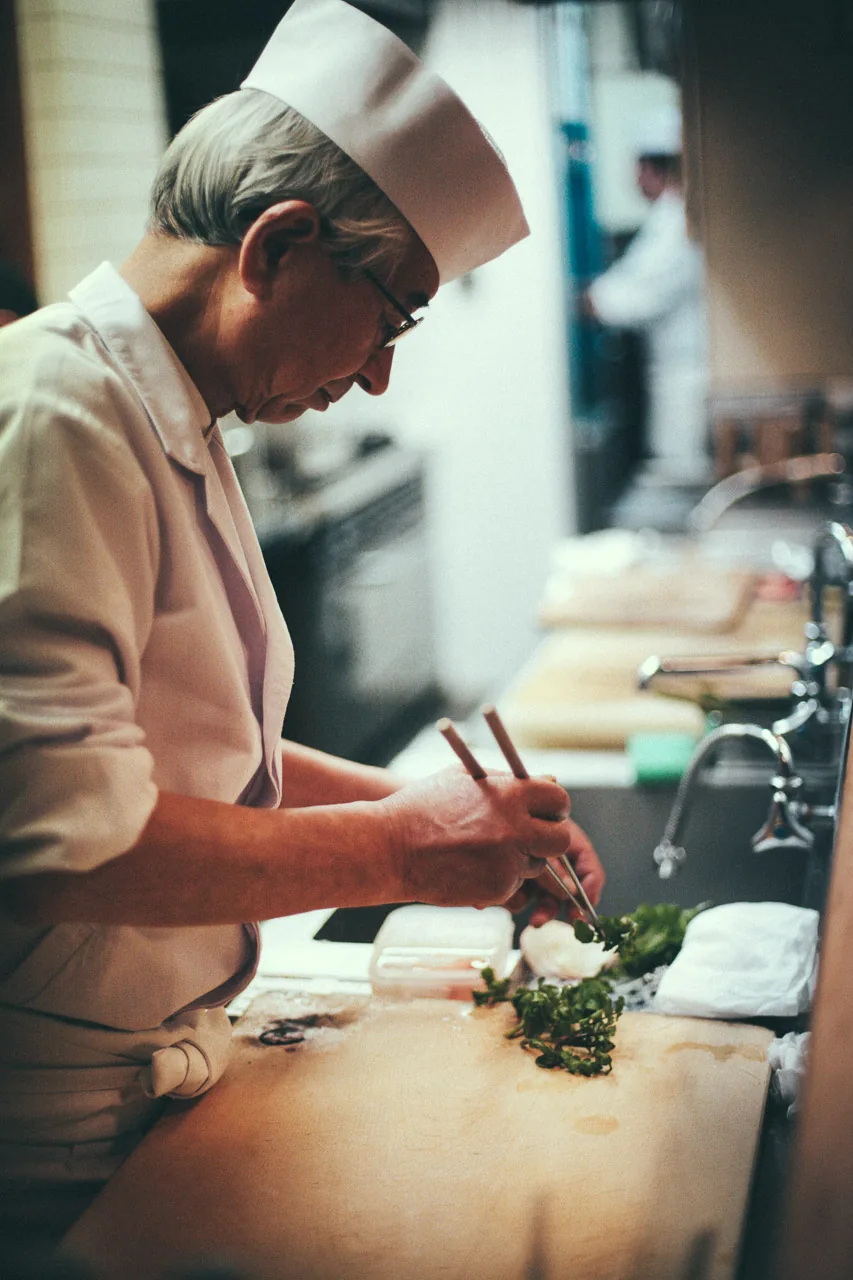 The chef preparing a dish