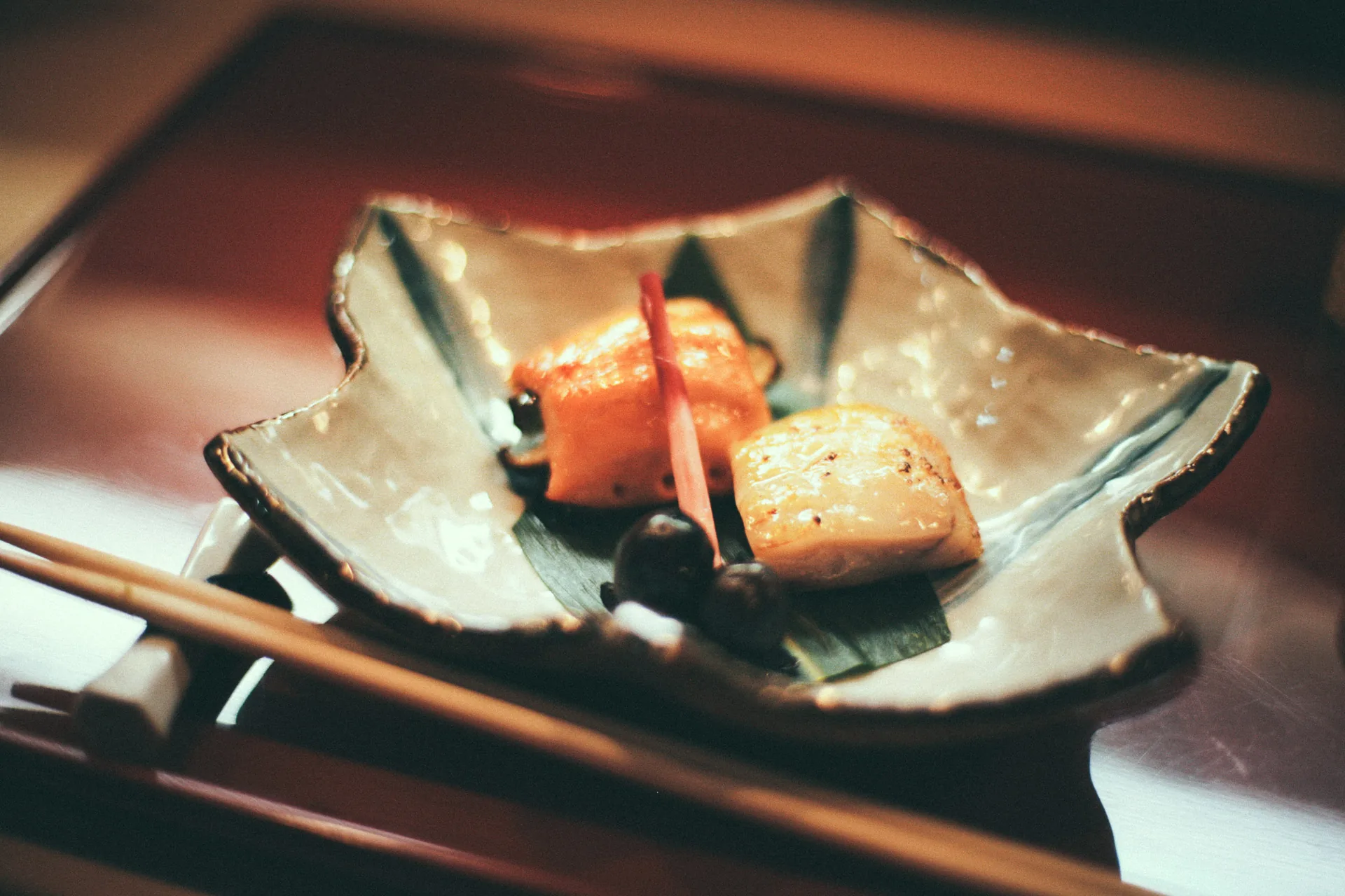 Grilled fish on a leaf-shaped dish