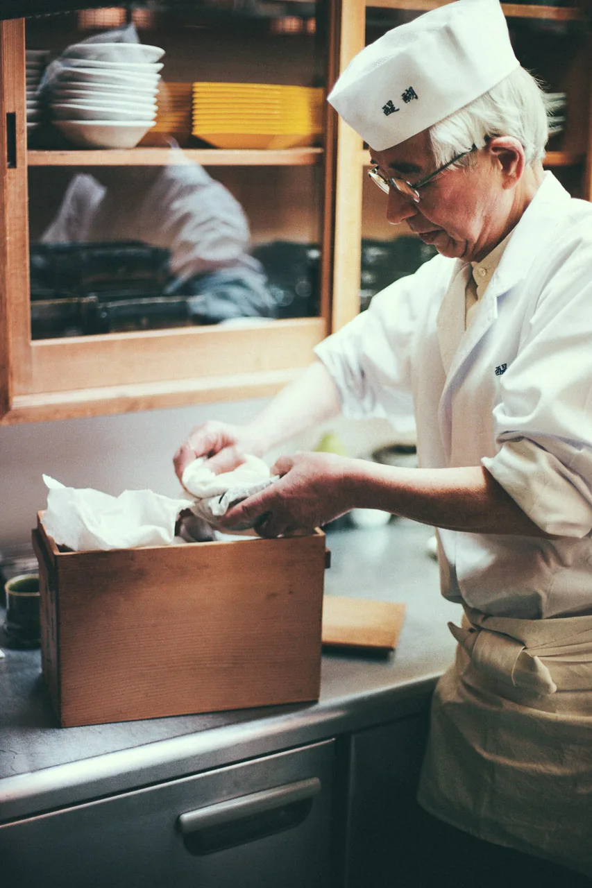 The chef unpacking an antique dish