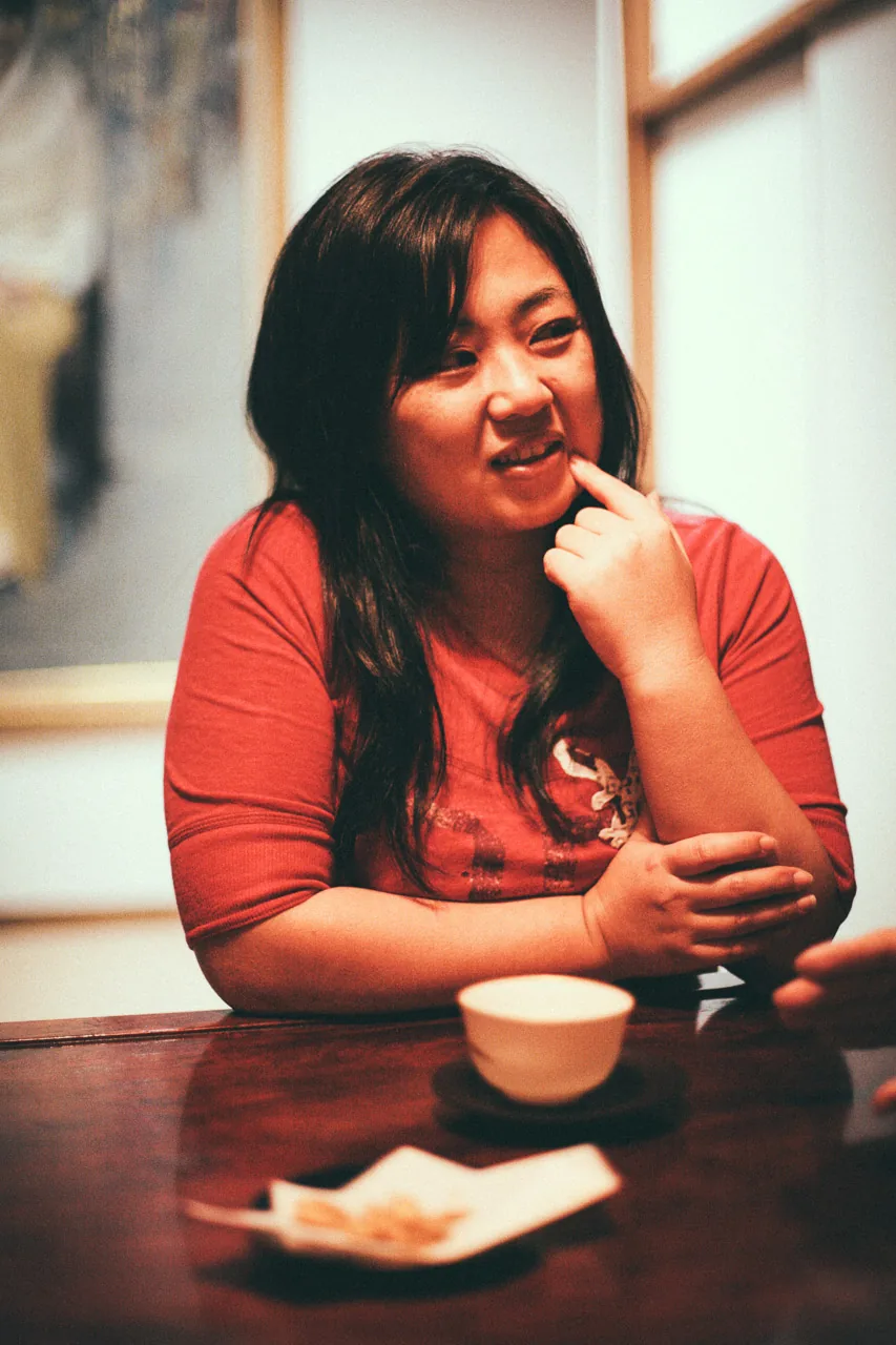 Rie at the table after dinner