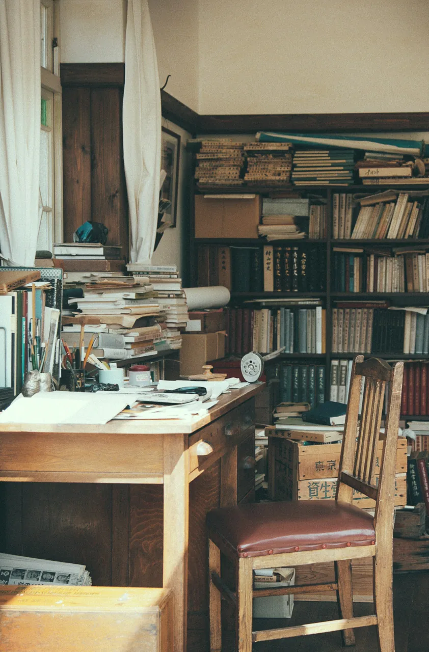 Books piled up in the study