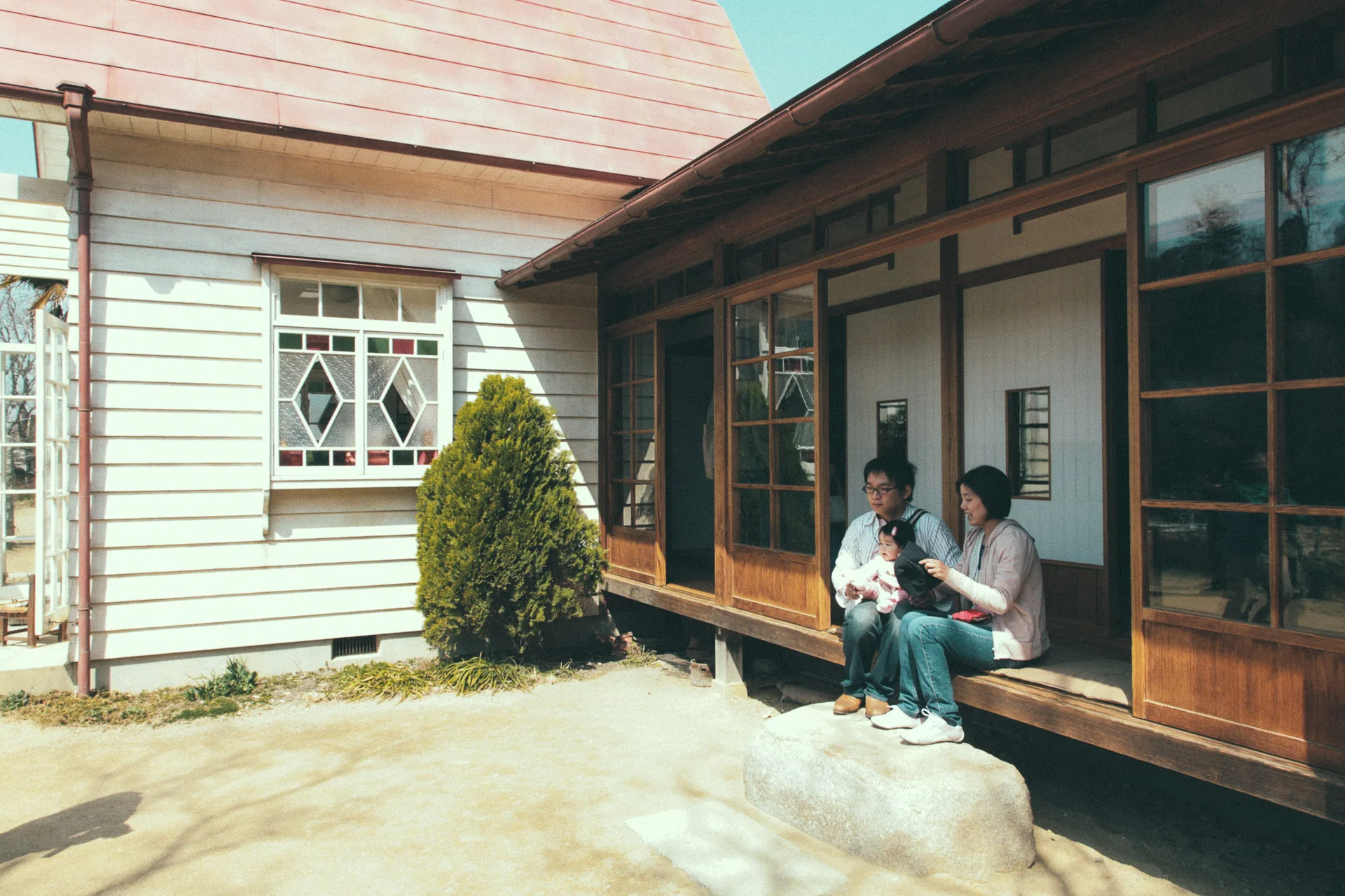 Sitting on the veranda of the house