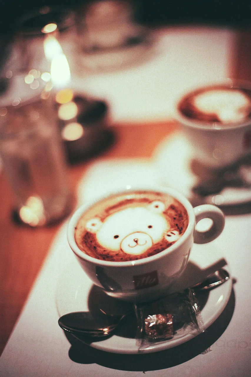 A cappuccino with a bear in the foam