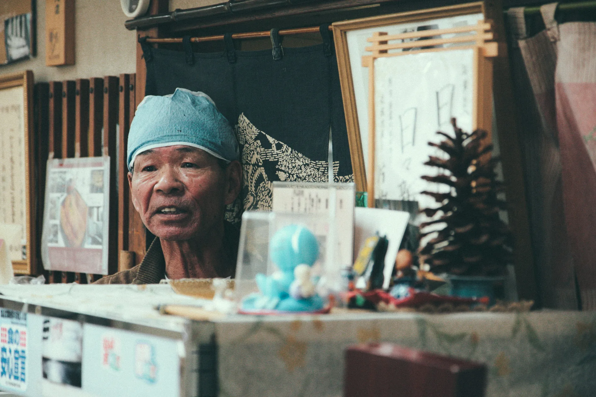 The owner of the unagi restaurant behind the counter