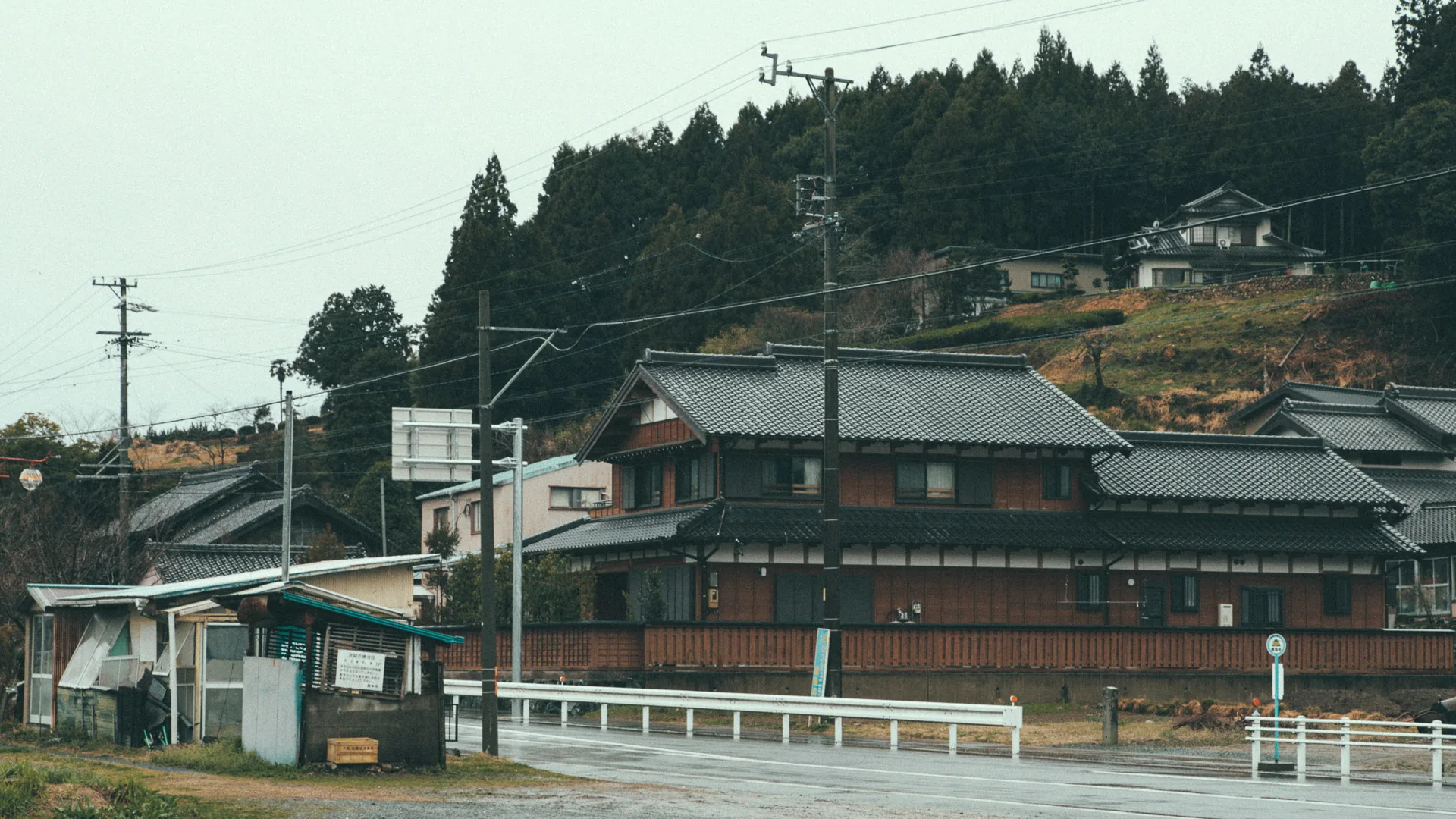 A traditional wooden house by the road