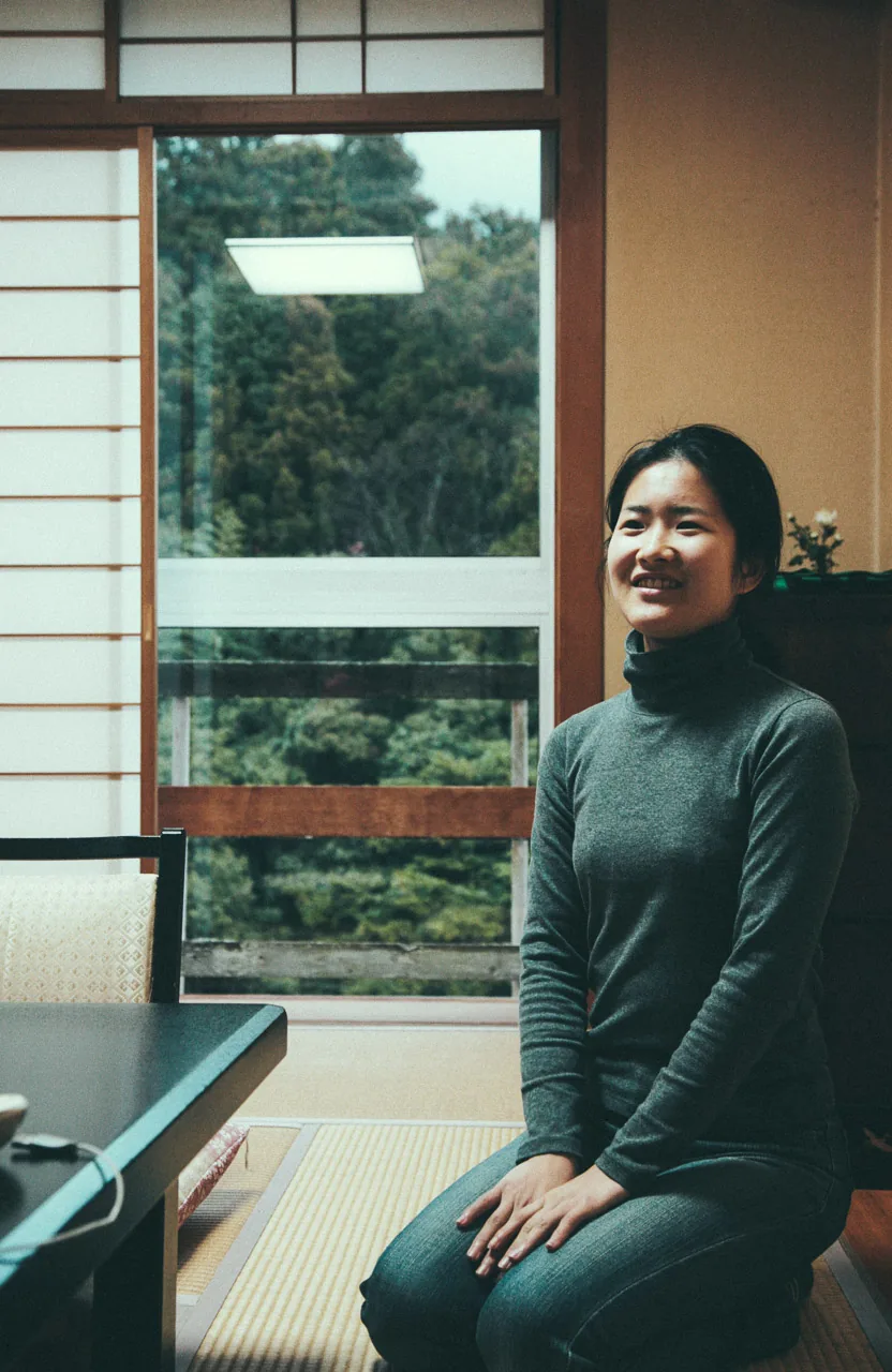 Yasuko by the window of the room