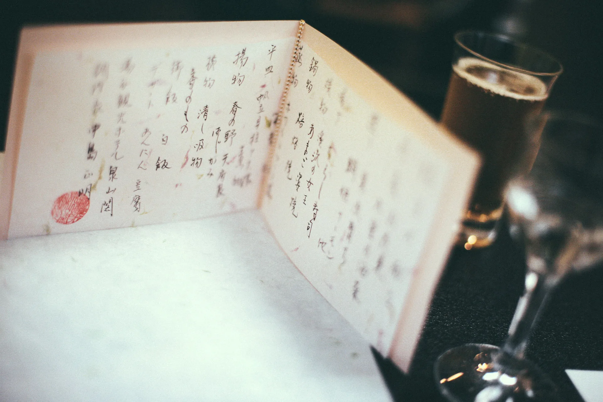 The handwritten dinner menu and a glass of beer