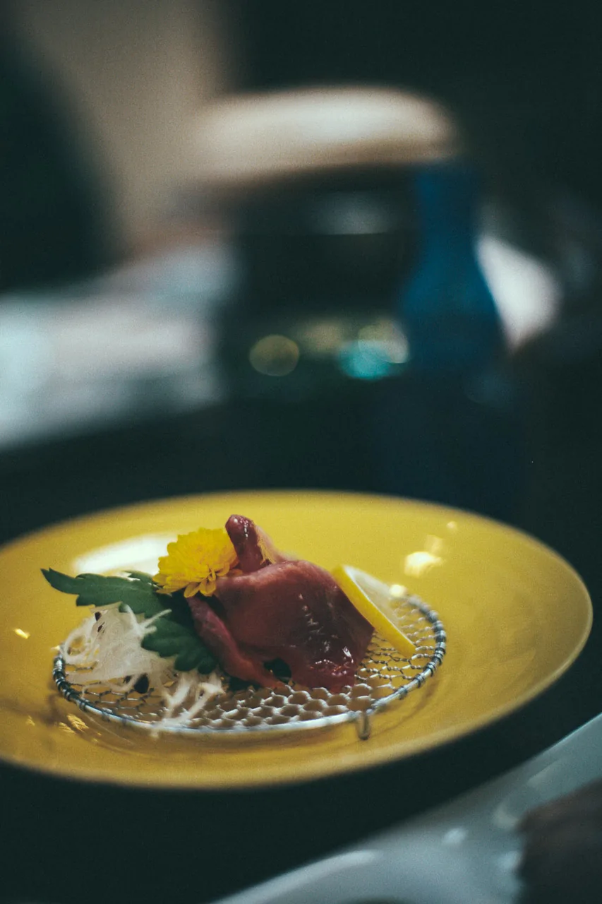 Sashimi on a yellow plate