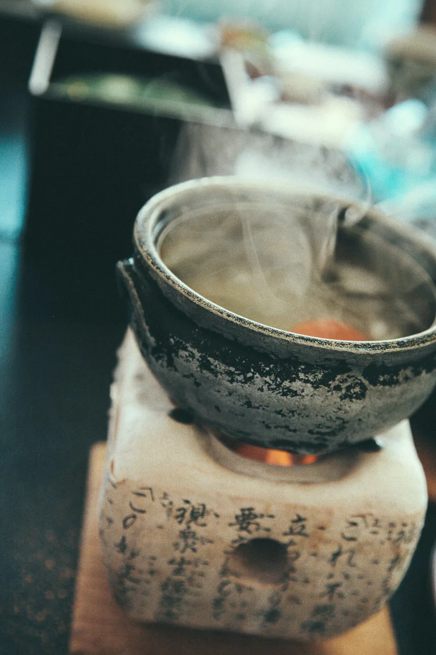 Steam rising from the clay pot