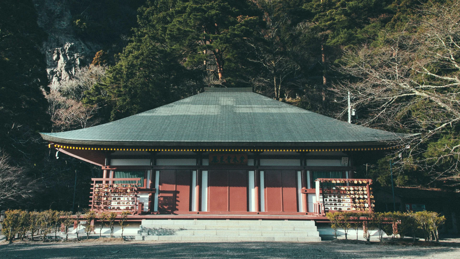 A temple hall below the cliffs