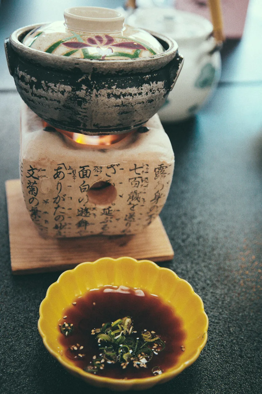 A clay pot over a burner at breakfast