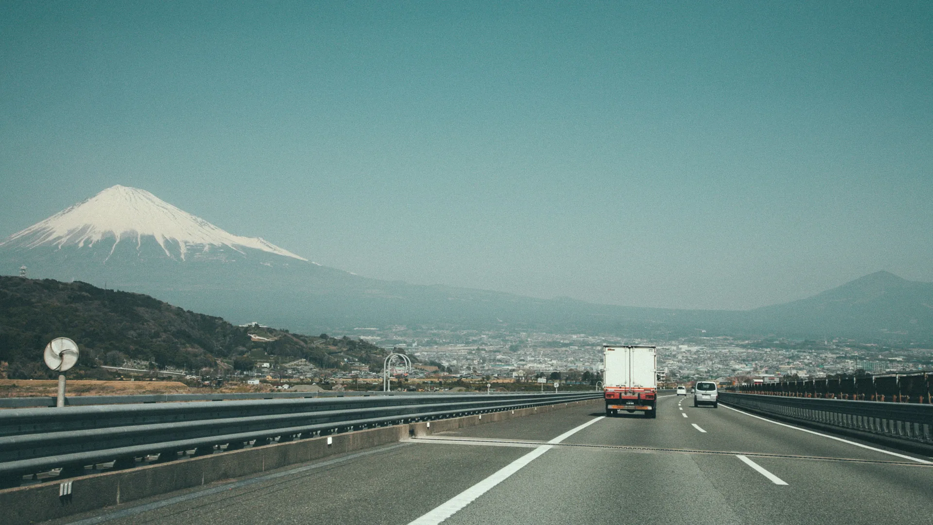 Mount Fuji above the expressway and the city