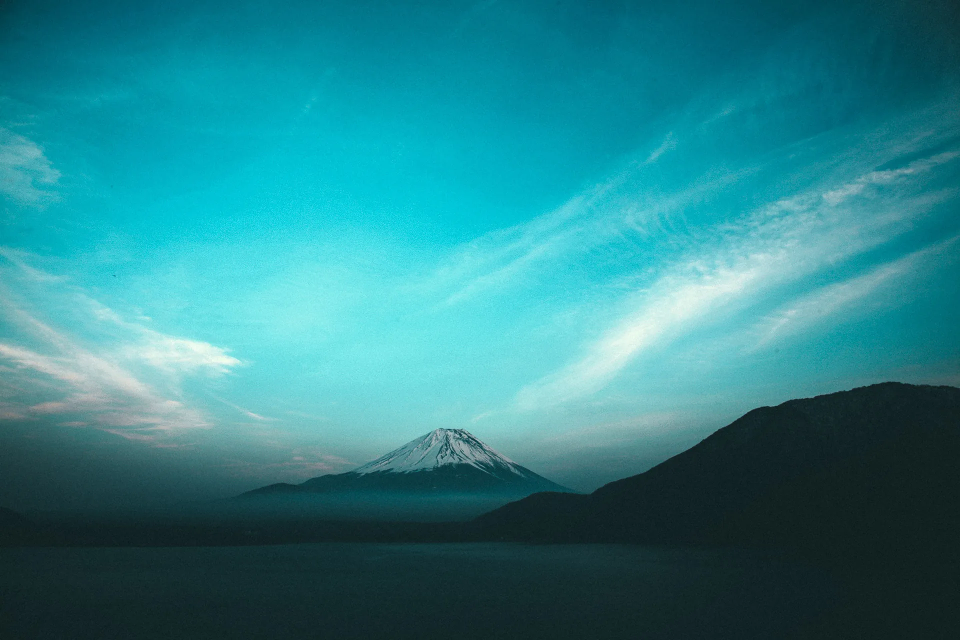 Mount Fuji under a dramatic evening sky