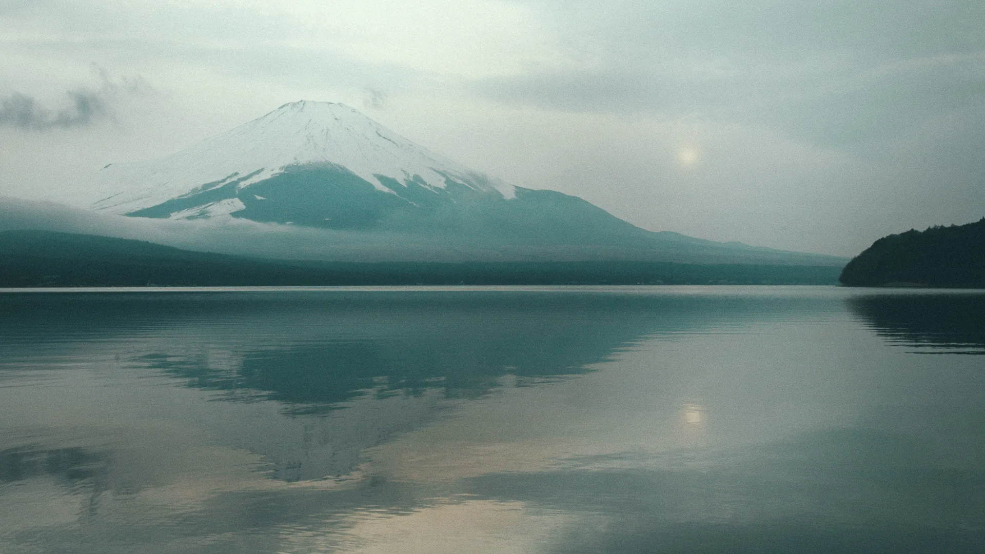 Mount Fuji reflected in Lake Yamanakako at dusk