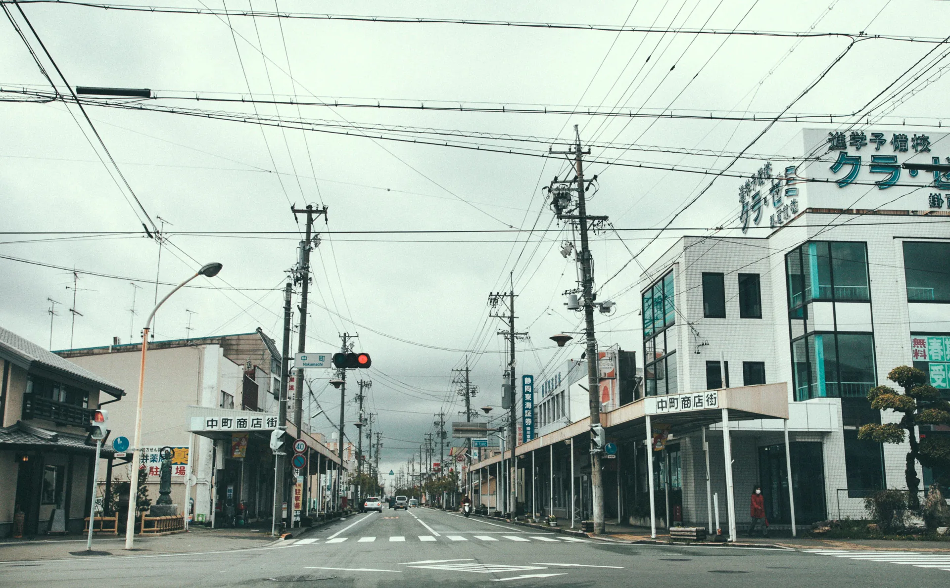A wide street lined with shops