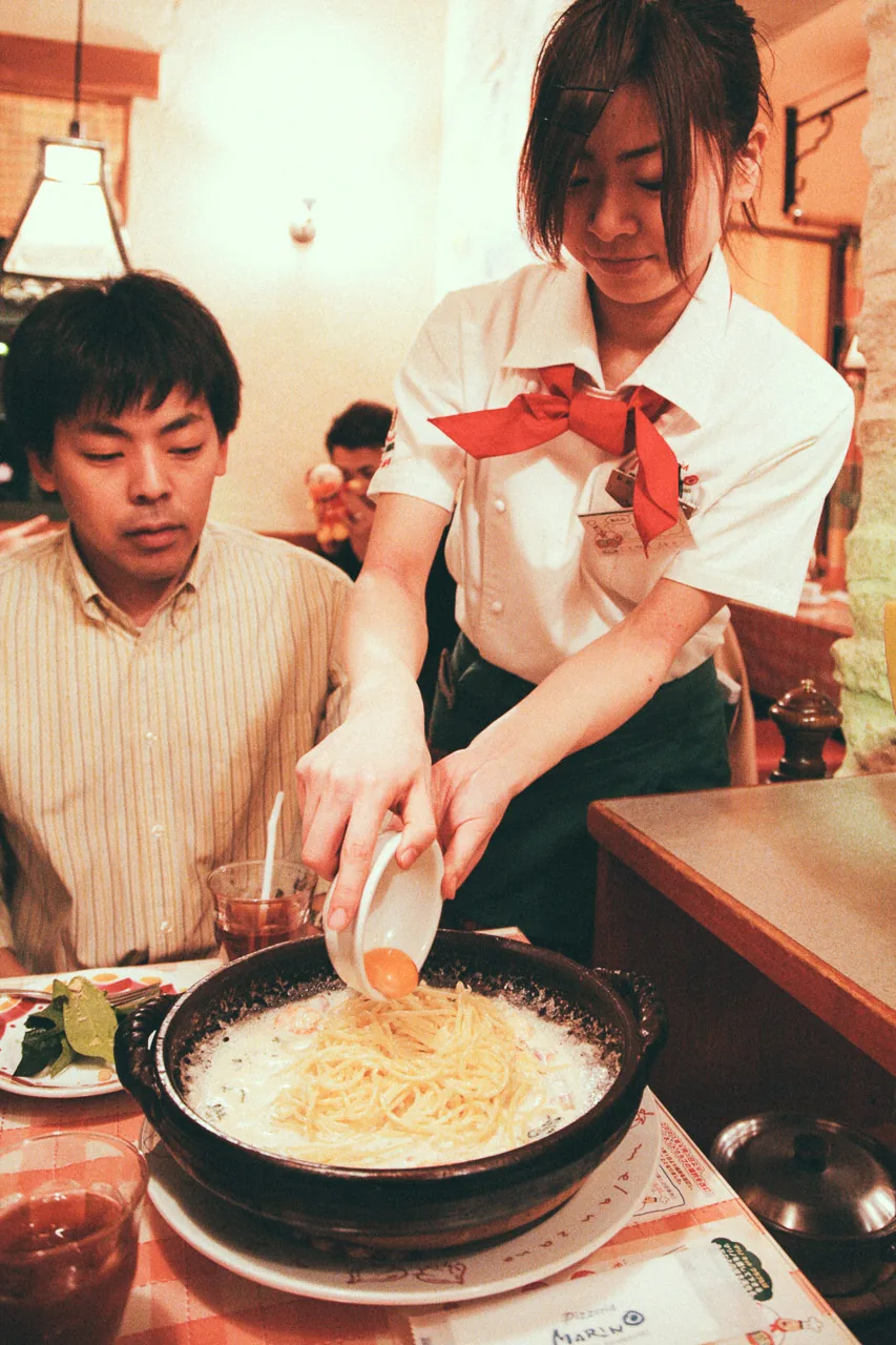 Serving pasta at the table