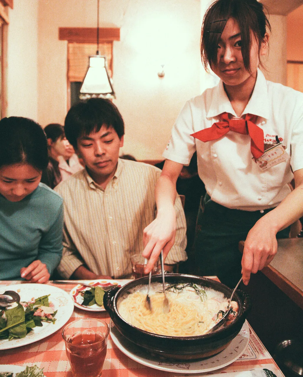 Mixing the pasta at the table