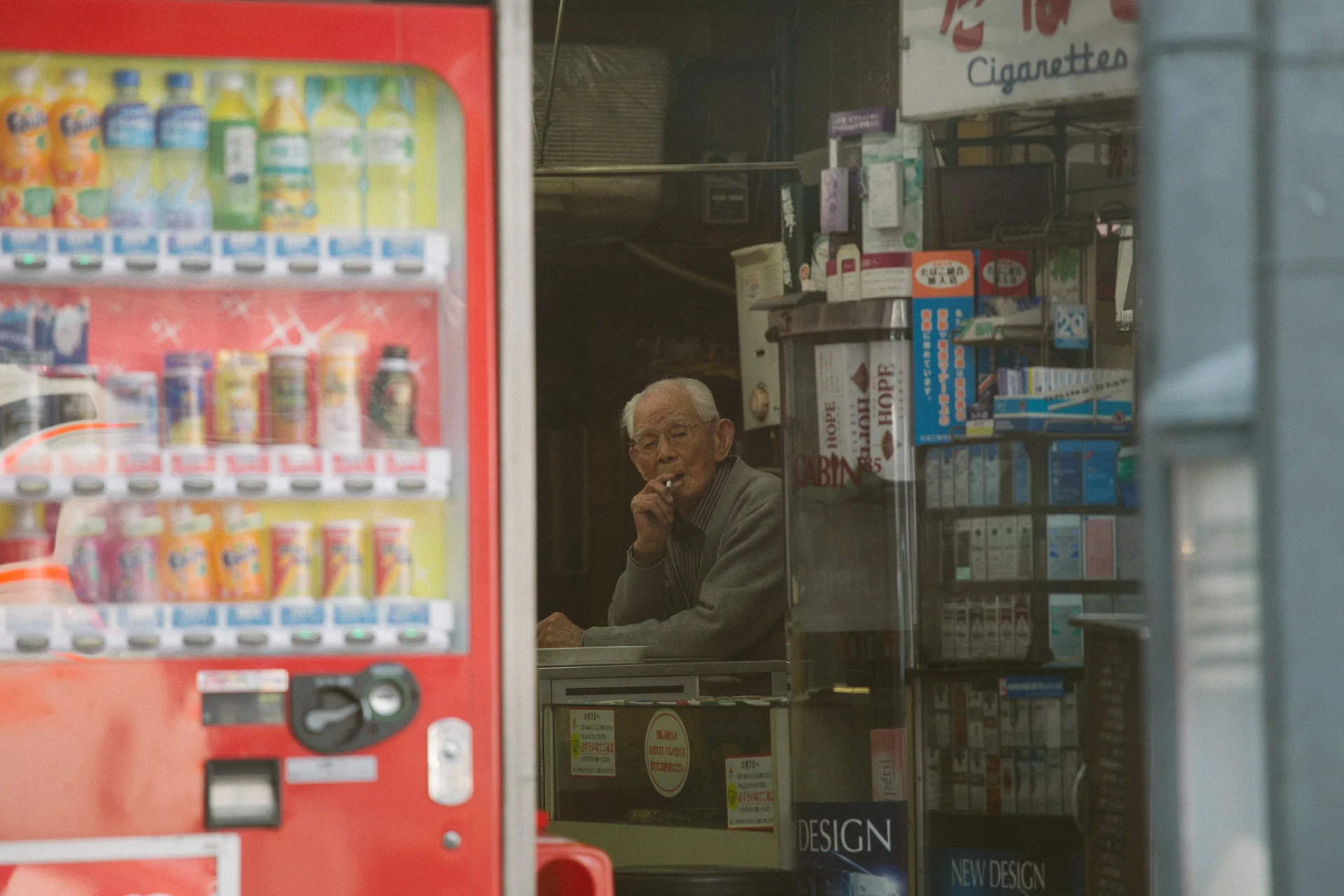 A tobacco shop owner among vending machines