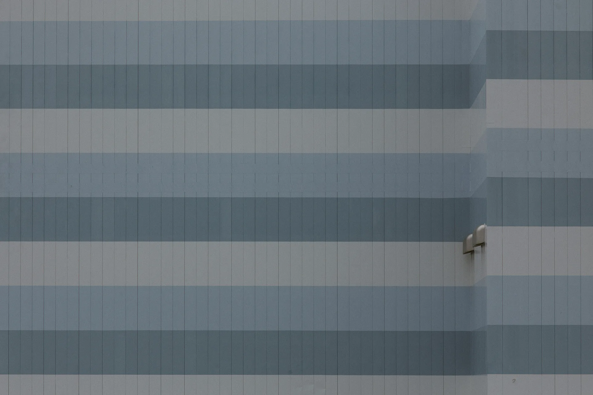 A wall of blue and grey stripes